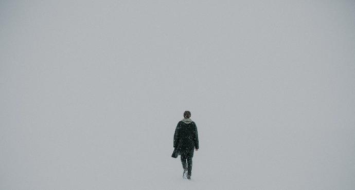 man walking on white surface